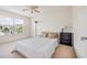 Bedroom with a queen-size bed, window, and ceiling fan at 257 Connemara Dr. # E, Myrtle Beach, SC 29579