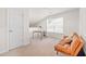 Bright bonus room with a sofa, table and window at 257 Connemara Dr. # E, Myrtle Beach, SC 29579