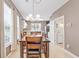 Dining area with table, chairs, and view into kitchen at 257 Connemara Dr. # E, Myrtle Beach, SC 29579