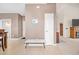Bright entryway with tile flooring, bench, and coat closet at 257 Connemara Dr. # E, Myrtle Beach, SC 29579
