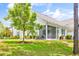 House exterior with a screened porch and yard at 257 Connemara Dr. # E, Myrtle Beach, SC 29579