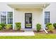 Townhome front entrance with a covered porch and landscaping at 257 Connemara Dr. # E, Myrtle Beach, SC 29579