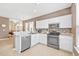 Modern kitchen with stainless steel appliances and tile floor at 257 Connemara Dr. # E, Myrtle Beach, SC 29579