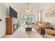 Spacious living room with fireplace, large TV and golf course view at 257 Connemara Dr. # E, Myrtle Beach, SC 29579