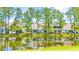 Houses with water access and lush green landscaping at 257 Connemara Dr. # E, Myrtle Beach, SC 29579