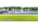 Expansive backyard with lush green grass overlooking a calm lake at 265 Venice Way # 1101, Myrtle Beach, SC 29577