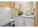 Bathroom with tropical-themed murals, tub/shower combo and white vanity with drawers and cabinets at 265 Venice Way # 1101, Myrtle Beach, SC 29577