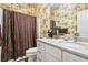 Bathroom features tropical-themed wallpaper, white vanity with granite counters and shower with dark curtain at 265 Venice Way # 1101, Myrtle Beach, SC 29577
