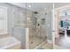 Modern bathroom with a glass-enclosed shower, soaking tub, and stylish tile work at 265 Venice Way # 1101, Myrtle Beach, SC 29577