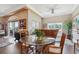 Bright dining area features a glass table, wood chairs, and large windows with views of the outdoor scenery at 265 Venice Way # 1101, Myrtle Beach, SC 29577
