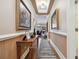 Elegant foyer with beautiful artwork, hardwood floors, and stylish decor at 265 Venice Way # 1101, Myrtle Beach, SC 29577