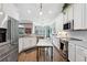 Spacious kitchen featuring stainless appliances, island and white cabinets at 265 Venice Way # 1101, Myrtle Beach, SC 29577