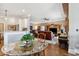 Open-concept living space features a kitchen, dining area, and a comfortable seating area with a large entertainment center at 265 Venice Way # 1101, Myrtle Beach, SC 29577