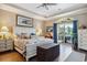 Serene main bedroom features a king-sized bed, balcony access, and scenic outdoor views at 265 Venice Way # 1101, Myrtle Beach, SC 29577