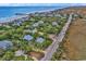 Aerial view of beach house near ocean and marsh, showing road and houses at 298 Myrtle Ave., Pawleys Island, SC 29585