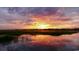 Stunning sunset over the marsh with water reflections at 298 Myrtle Ave., Pawleys Island, SC 29585