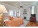 Spacious bedroom with fireplace and large windows at 301 North Main St., Hemingway, SC 29554