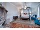 Elegant bedroom with four-poster bed and sitting area at 301 North Main St., Hemingway, SC 29554