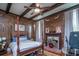 Bedroom with wood-paneled walls and fireplace at 301 North Main St., Hemingway, SC 29554