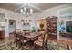 Elegant dining room with hardwood floors, a fireplace, and a large dining table at 301 North Main St., Hemingway, SC 29554