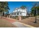Two-story white house with black fence and brick pillars at 301 North Main St., Hemingway, SC 29554