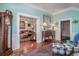 Bright hallway with antique furniture and blue walls at 301 North Main St., Hemingway, SC 29554