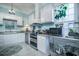 Modern kitchen with white cabinets, stainless steel appliances, and granite countertops at 301 North Main St., Hemingway, SC 29554