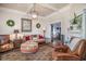 Spacious living room with ornate rug and leather armchairs at 301 North Main St., Hemingway, SC 29554