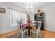 Charming dining room with round table, four chairs, and chandelier at 303 Flagstone Dr., Myrtle Beach, SC 29588