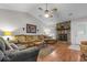 Relaxing living area with stone fireplace, hardwood floors, and sectional sofa at 303 Flagstone Dr., Myrtle Beach, SC 29588