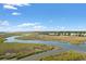 Aerial view of waterfront property with marsh and waterway access at 34 Lazy Hammock Trail, Pawleys Island, SC 29585