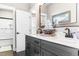 Elegant bathroom with double vanity, marble countertop, and large mirror at 34 Lazy Hammock Trail, Pawleys Island, SC 29585