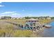 Wooden dock with gazebo offering scenic waterway views at 34 Lazy Hammock Trail, Pawleys Island, SC 29585