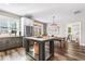 Spacious kitchen with an island, stainless steel appliances, and dark gray cabinets at 34 Lazy Hammock Trail, Pawleys Island, SC 29585