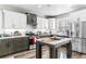 Modern kitchen with stainless steel appliances and a large island at 34 Lazy Hammock Trail, Pawleys Island, SC 29585