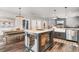 Open kitchen with island, farmhouse table, and stainless steel appliances at 34 Lazy Hammock Trail, Pawleys Island, SC 29585