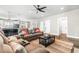 Open living room with comfortable seating, coffee table and view into kitchen area at 34 Lazy Hammock Trail, Pawleys Island, SC 29585