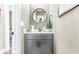 Small powder room with gray vanity and marble countertop at 34 Lazy Hammock Trail, Pawleys Island, SC 29585