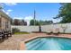 Inviting backyard oasis featuring a refreshing pool, brick patio, and lounge chairs at 341 N Bar Ct., Myrtle Beach, SC 29579