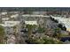Sprawling aerial view of a shopping center, parking lot, and residential area at 38 Shadow Moss Pl. # 38, North Myrtle Beach, SC 29582