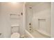 All white bathroom featuring a toilet, tub, and shower combination at 38 Shadow Moss Pl. # 38, North Myrtle Beach, SC 29582