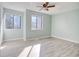A bright bedroom with light walls and two windows at 38 Shadow Moss Pl. # 38, North Myrtle Beach, SC 29582