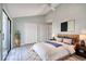 This staged bedroom features a ceiling fan and a sliding glass door at 38 Shadow Moss Pl. # 38, North Myrtle Beach, SC 29582