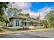 Charming exterior view of a residential building with lush landscaping and an American flag at 38 Shadow Moss Pl. # 38, North Myrtle Beach, SC 29582