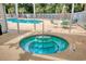 Inviting in-ground hot tub next to a pristine pool area, ideal for relaxation at 38 Shadow Moss Pl. # 38, North Myrtle Beach, SC 29582