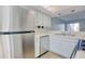 Close-up of kitchen with stainless steel refrigerator, ample cabinet space, and countertops at 38 Shadow Moss Pl. # 38, North Myrtle Beach, SC 29582