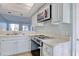 Functional kitchen with range, microwave, and view of the living area, great for entertaining at 38 Shadow Moss Pl. # 38, North Myrtle Beach, SC 29582