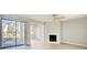 Bright living room features a fireplace, wood floors, and sliding glass doors to the exterior at 38 Shadow Moss Pl. # 38, North Myrtle Beach, SC 29582
