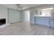 Open concept living room with wood floors and breakfast bar to the kitchen at 38 Shadow Moss Pl. # 38, North Myrtle Beach, SC 29582
