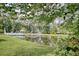 Community pond with a water fountain at 38 Shadow Moss Pl. # 38, North Myrtle Beach, SC 29582
